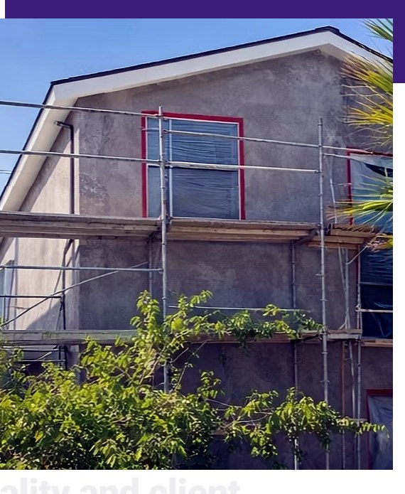 Home exterior construction project with scaffolding